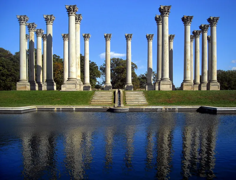 The National Capitol Columns standing in a meadow at the U.S. National Arboretum